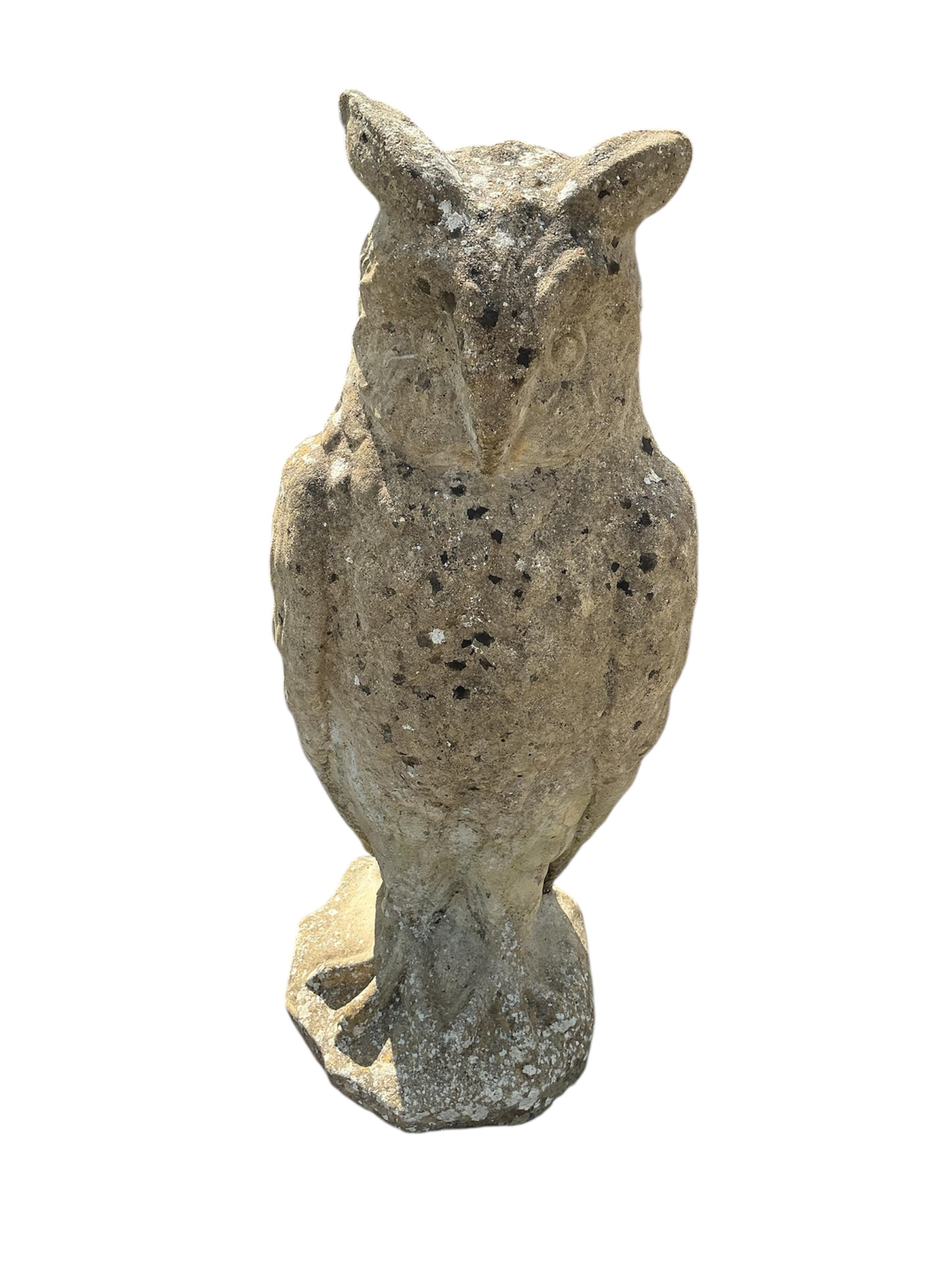 A reconstituted stone owl garden ornament, height 72cm